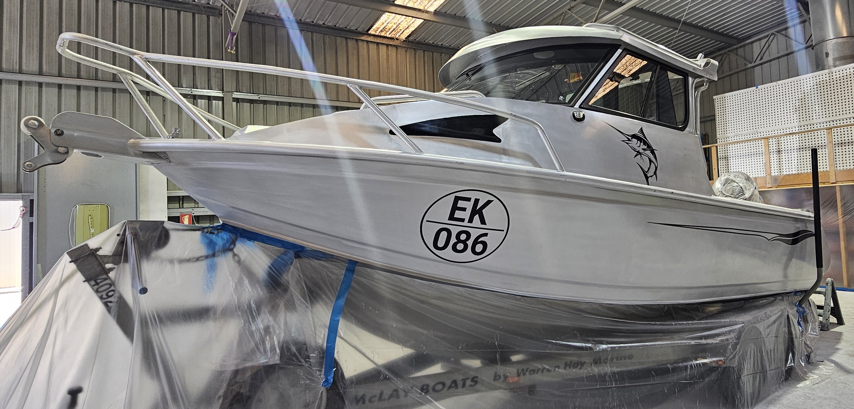Finished aluminium boat with NYALIC protection completed by Extreme Finishings Perth